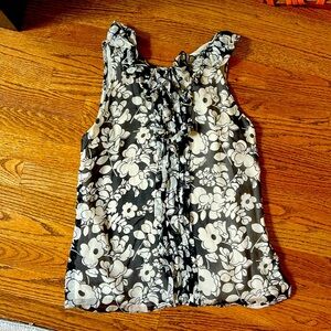 Silk black and white Milly sleeveless top. Size 4. Excellent used condition.